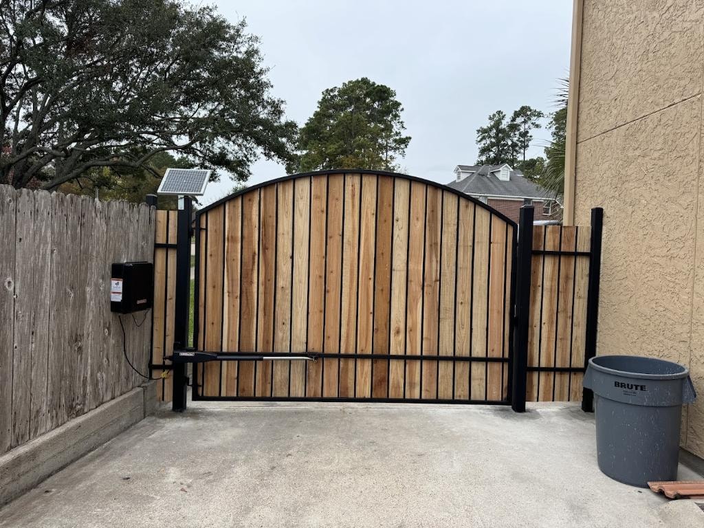 Custom driveway gate installation in The Woodlands TX by Access Pro Gate Company